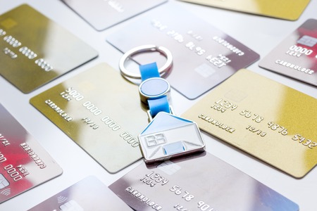 credit cards concept mortgag for new home on white background