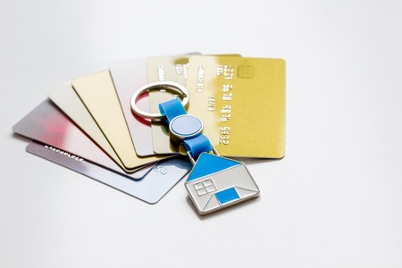 credit cards, key ring - concept mortgage on white backgroundの写真素材