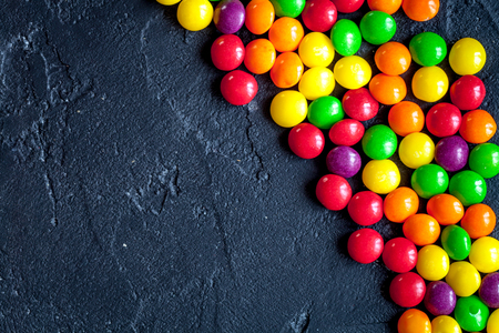 sweets and sugar candies on dark background top viewの写真素材