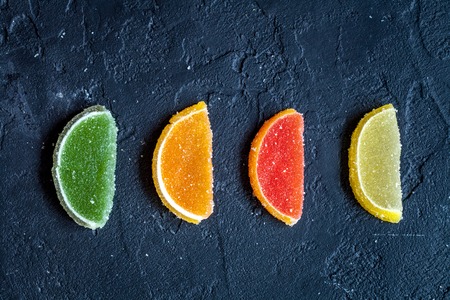sweets and sugar candies on dark background top viewの写真素材