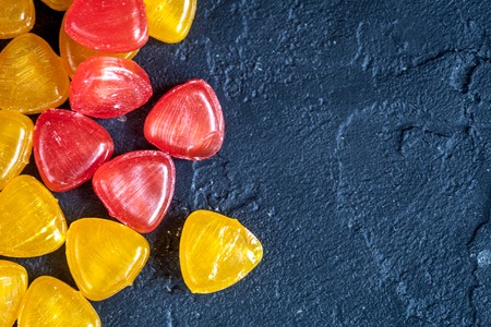 sweets and sugar candies on dark background top viewの写真素材