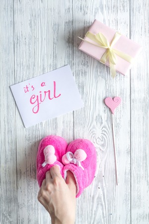 birth of girl - baby shower concept on wooden background top viewの写真素材