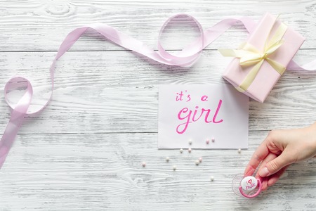 birth of girl - baby shower concept on wooden background top viewの写真素材