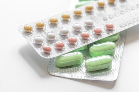 concept of female contraception on white background close upの写真素材