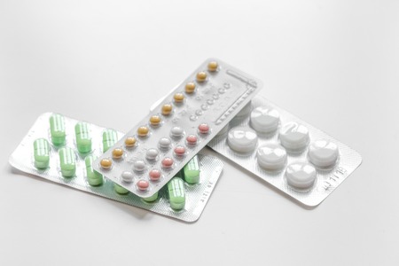 concept of female contraception on white background close upの写真素材