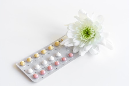 concept of female contraception on white background close upの写真素材