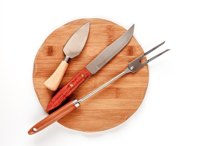 wooden kitchen utensils on white wooden background top view
