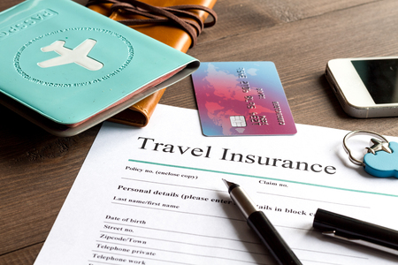 concept booking travel insurance on wooden background close upの写真素材