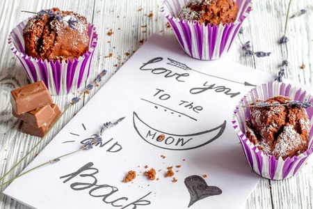 concept of Valentine's Day cupcakes on wooden background close upの写真素材