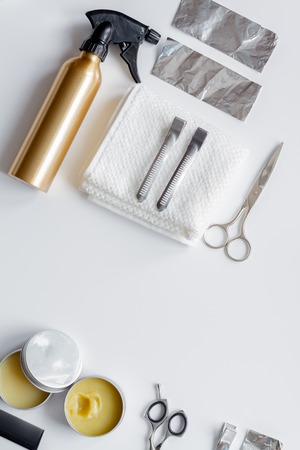 hairdresser working desk preparation for cutting hair top view on white backgroundの写真素材