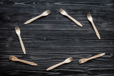 wooden kitchen utensils on dark background top view mock upの写真素材