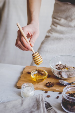making organic scrub handmade at home with hands.の写真素材