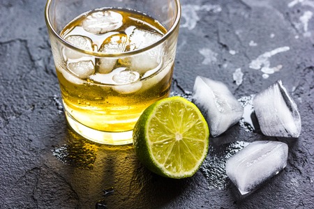 glass of whiskey on dark backgroundの写真素材