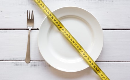 concept diet and weight loss on wooden background top viewの写真素材