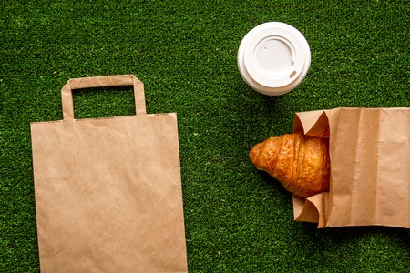 take out in paper bag on green background top viewの写真素材