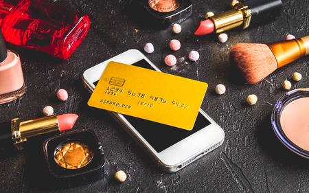 concept online shopping cosmetics on dark backgroundの写真素材