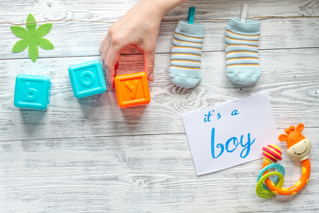 birth of boy - baby shower concept on wooden backgroundの写真素材
