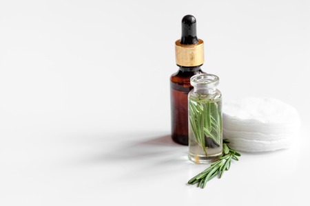 organic cosmetics with extracts of herbs rosemary on white backgroundの写真素材