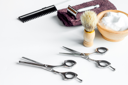 white desktop with tools for shaving beards close upの写真素材