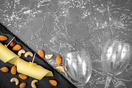 red wine with cheese on dark background top view.の写真素材