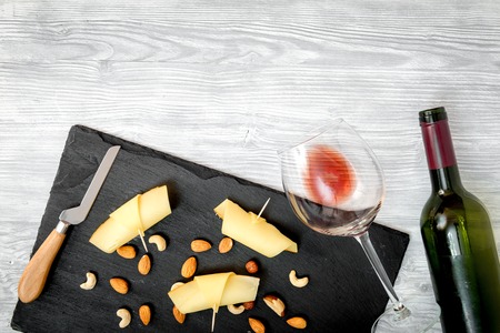 red wine with cheese on wooden background top view.の写真素材