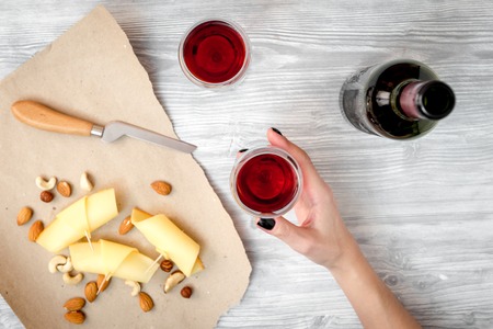 red wine with cheese on wooden background top view.の写真素材
