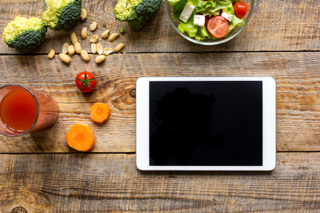 concept diet and tablet with vegetables mock upの写真素材