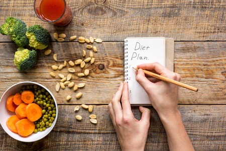 concept diet, slimming plan with vegetables top view mock upの写真素材