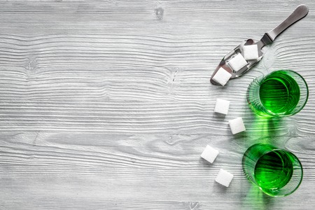 absinthe in glass on wooden background top view mock upの写真素材