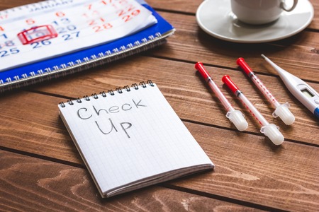 concept time health check up on wooden backgroundの写真素材