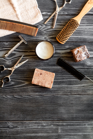 Tools for cutting beard barbershop top view on dark wooden backgroundの写真素材