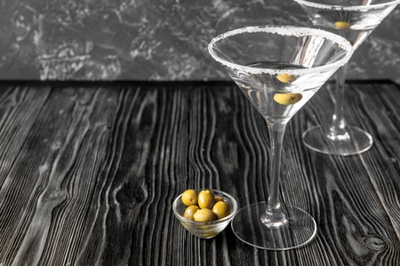 martini cocktail at wooden background close upの写真素材