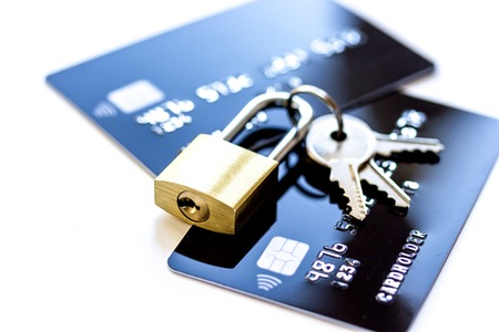 Credit cards with lock close up - online shopping on white backgroundの写真素材