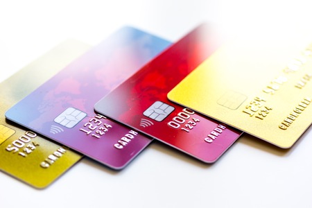 pile of credit cards on white background close upの写真素材