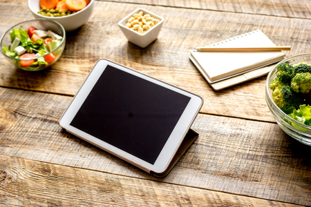concept diet and tablet with vegetables mock upの写真素材