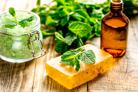 organic cosmetics with herbal extracts of mint on wooden backgroundの写真素材
