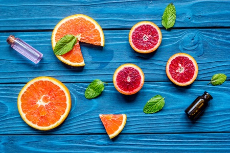 organic cosmetic with citrus on blue background top viewの写真素材