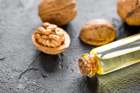 cosmetic and therapeutic walnut oil on dark backgroundの写真素材