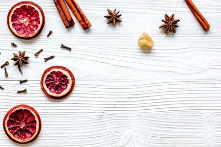 mulled wine with spices in cup on wooden background top viewの写真素材