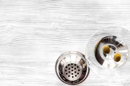 martini and shaker top view of wooden background.の写真素材
