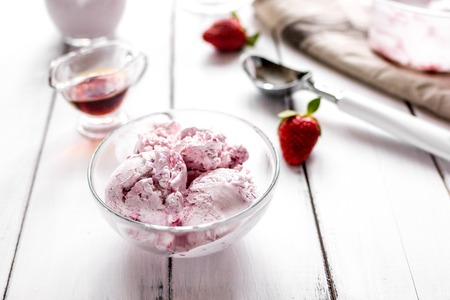 organic homemade ice cream in glass bowl on wooden backgroundの写真素材