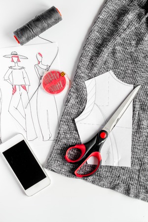 desktop designer clothes with tools top view mock up.の写真素材