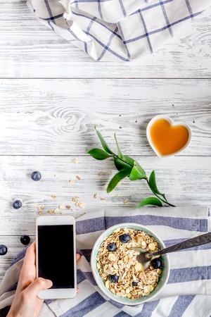 Breakfast concept with flowers on wooden background top viewの写真素材