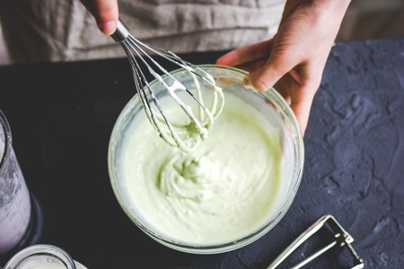 organic ice cream homemade process on dark background with handsの写真素材