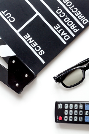 Screenwriter desktop with movie clapper board white background top viewの写真素材