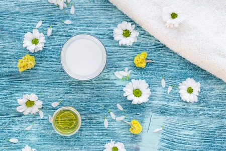 organic cosmetics with camomile on blue background top viewの写真素材