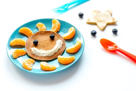 concept kid breakfast with pancake on white background.の写真素材