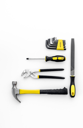 Tools for repairing top view on white layout.