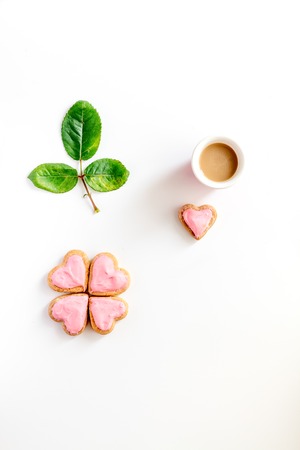 Valentine's Day heart-shaped cookies on white layout top view.の写真素材