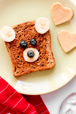 cooking breakfast for kid bear sandwiches top view on white background
